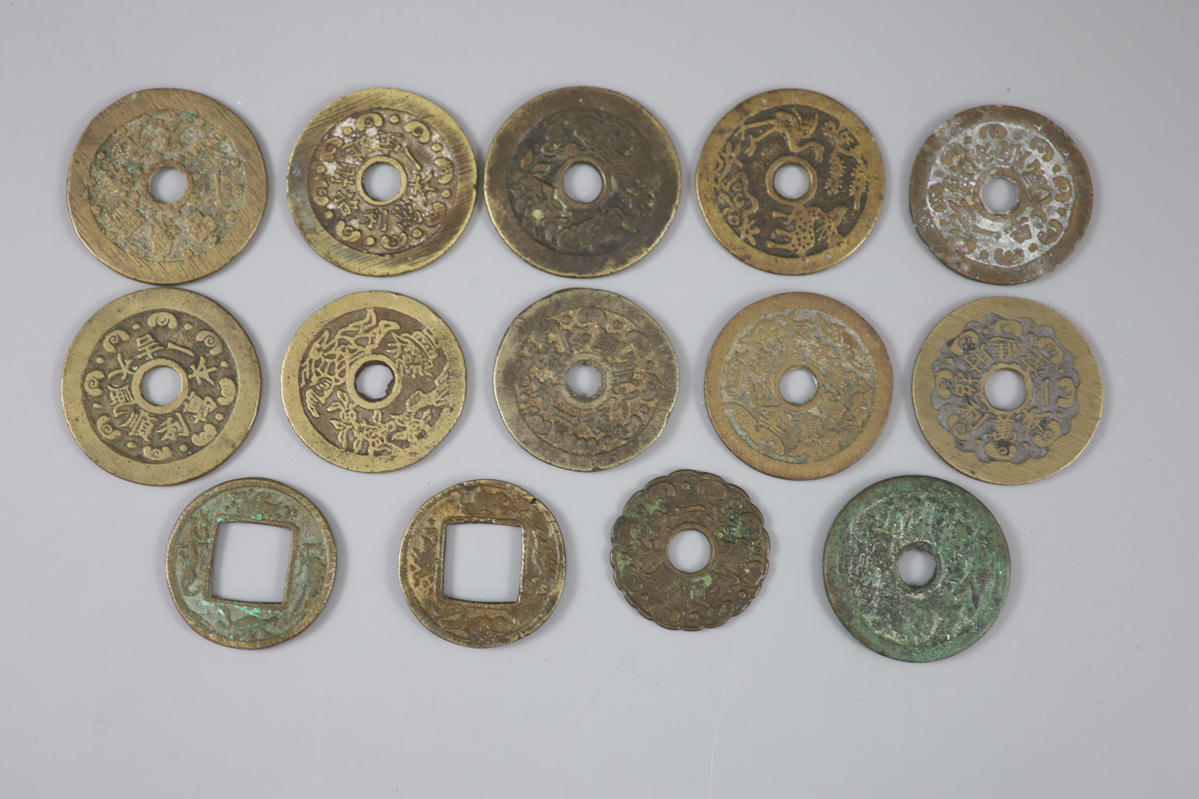 China, 14 cast bronze charms or amulets, Qing dynasty,